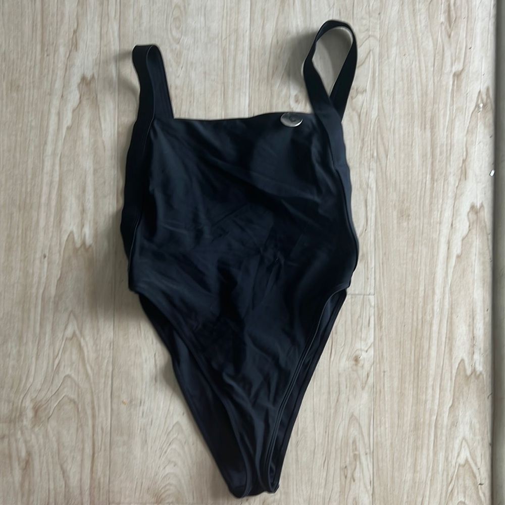 All black deep side cut one piece. It's giving SEXY!